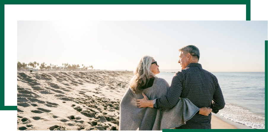 Broad Wealth Management - sweet couple walking at the beach